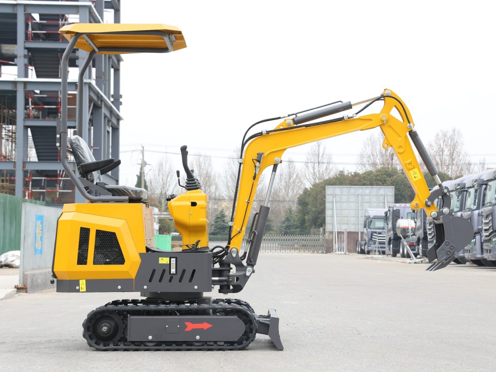 Excavator compact de 1 tonă, cu caroserie galbenă și bord din plámb, poziționat pe un teren asfaltat, cu un fundal de construcție.
Excavatoare 1 tona Oradea
Exacavator mic Oradea